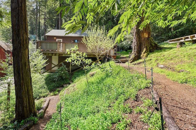 view of yard featuring a wooden deck