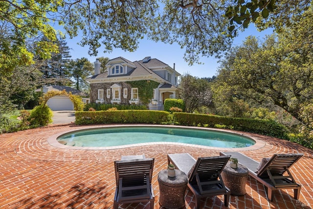 pool with a patio area