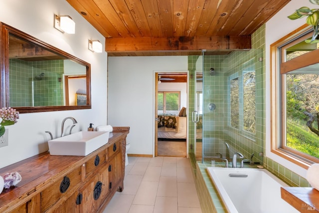 ensuite bathroom featuring vanity, connected bathroom, tiled shower, and wood ceiling