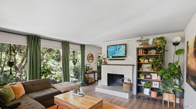 317 Olema Rd, Fairfax, CA 94930 - living area with plenty of natural light, wood finished floors, and a brick fireplace