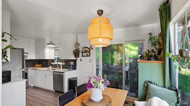 317 Olema Rd, Fairfax, CA 94930 - kitchen featuring appliances with stainless steel finishes, a sink, light countertops, white cabinetry, and backsplash