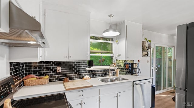 317 Olema Rd, Fairfax, CA 94930 - kitchen featuring wall chimney exhaust hood, appliances with stainless steel finishes, a sink, white cabinets, and tasteful backsplash