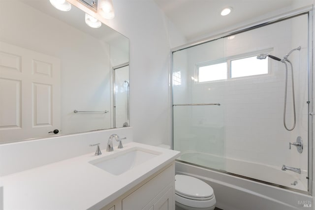 bathroom with toilet, vanity, enclosed tub / shower combo, and recessed lighting