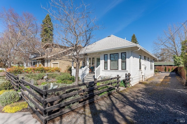 single story home with a fenced front yard