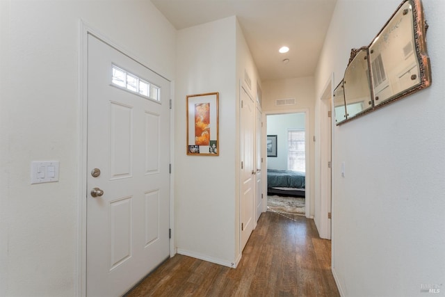 entrance foyer with recessed lighting, dark wood-style floors, baseboards, and visible vents