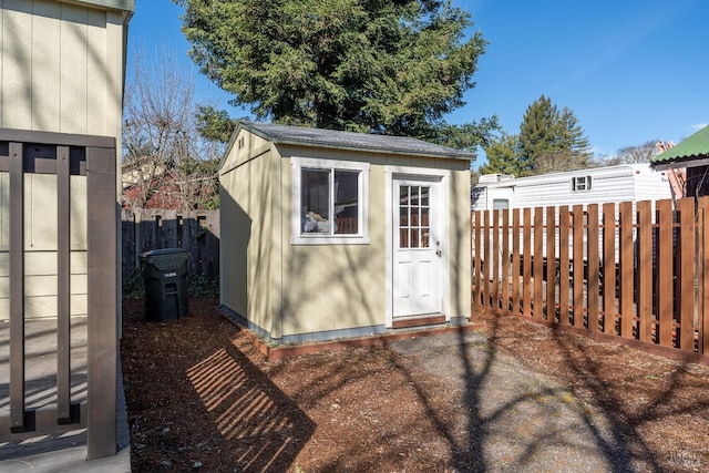 view of shed featuring a fenced backyard
