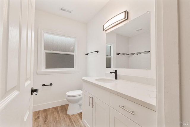 308 Central Ave, Vallejo, CA 94590 - bathroom featuring vanity, visible vents, wood finished floors, toilet, and baseboards