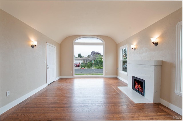 308 Central Ave, Vallejo, CA 94590 - unfurnished living room featuring baseboards, wood finished floors, lofted ceiling, and a high end fireplace