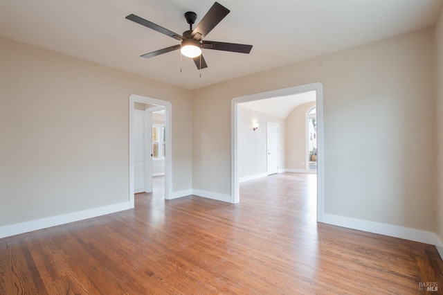 308 Central Ave, Vallejo, CA 94590 - spare room with arched walkways, baseboards, a ceiling fan, and light wood-style floors