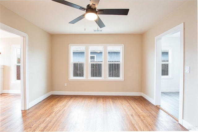 308 Central Ave, Vallejo, CA 94590 - empty room with light wood-type flooring, baseboards, visible vents, and a wealth of natural light