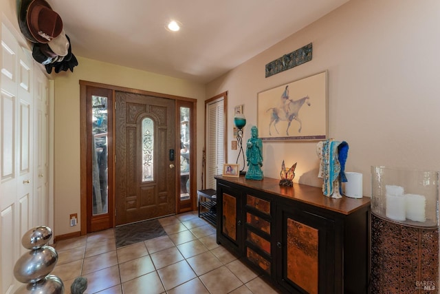 foyer entrance with light tile patterned floors
