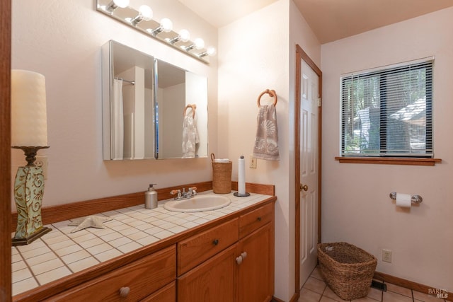 full bathroom with tile patterned floors, vanity, and baseboards