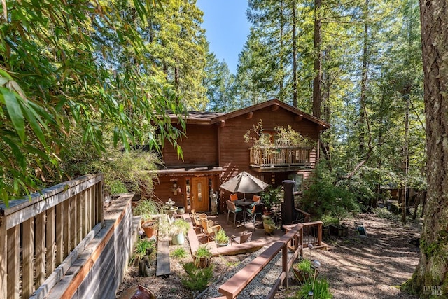 exterior space with outdoor dining area and fence