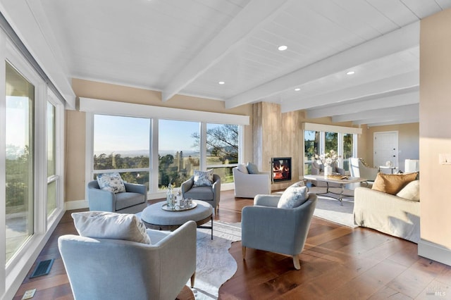 living area with recessed lighting, a large fireplace, dark wood-style floors, beamed ceiling, and visible vents