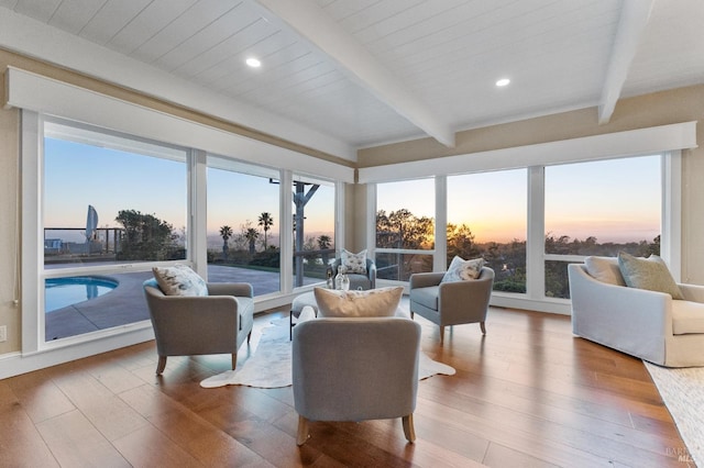 living room with recessed lighting, beamed ceiling, and wood finished floors