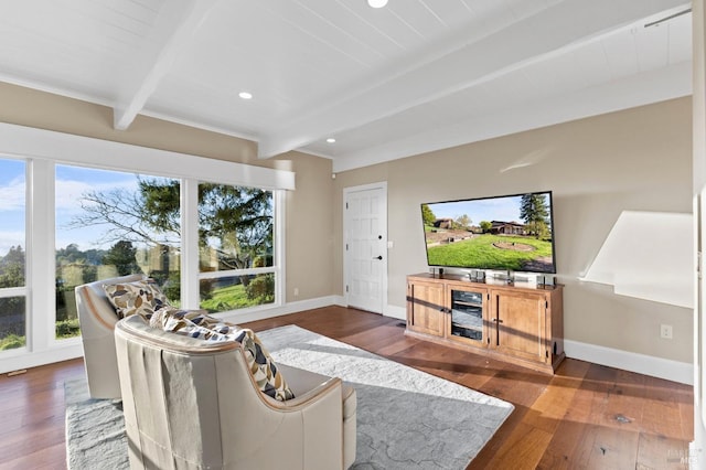 living area featuring baseboards, recessed lighting, beam ceiling, and dark wood-type flooring