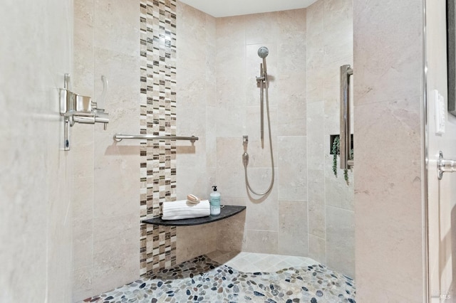 bathroom featuring tiled shower