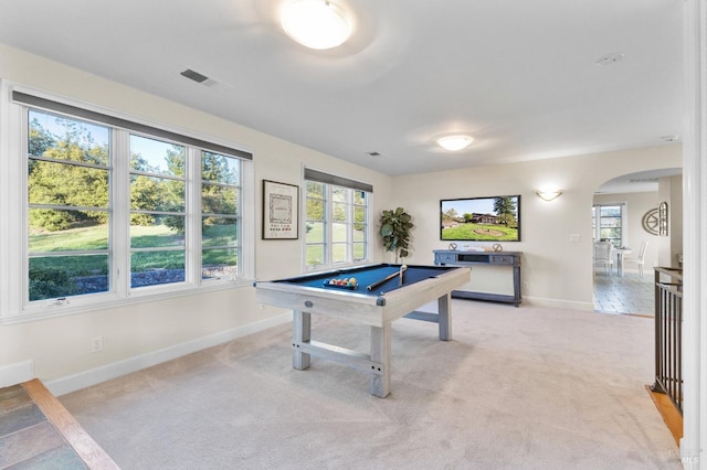 playroom with pool table, light carpet, baseboards, visible vents, and arched walkways