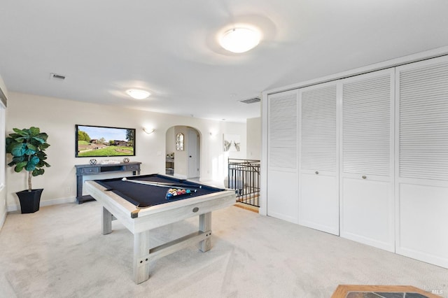 playroom featuring arched walkways, pool table, light colored carpet, and visible vents