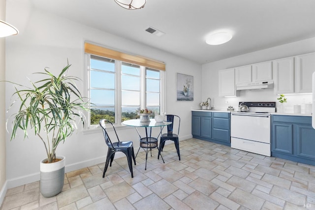 kitchen with light countertops, visible vents, white electric stove, blue cabinetry, and under cabinet range hood