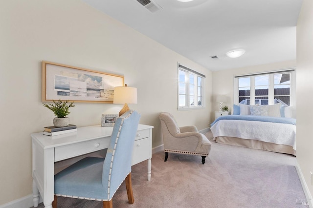 carpeted bedroom with baseboards and visible vents