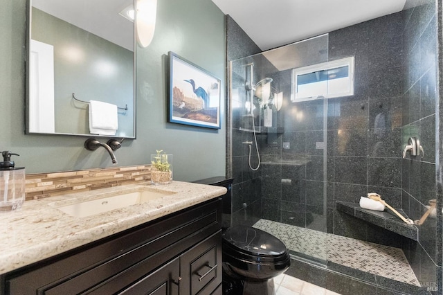 full bath with toilet, vanity, and a walk in shower