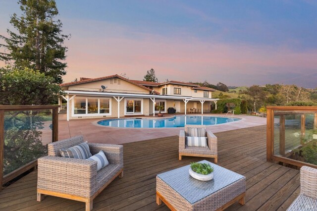 outdoor pool featuring an outdoor hangout area and a patio