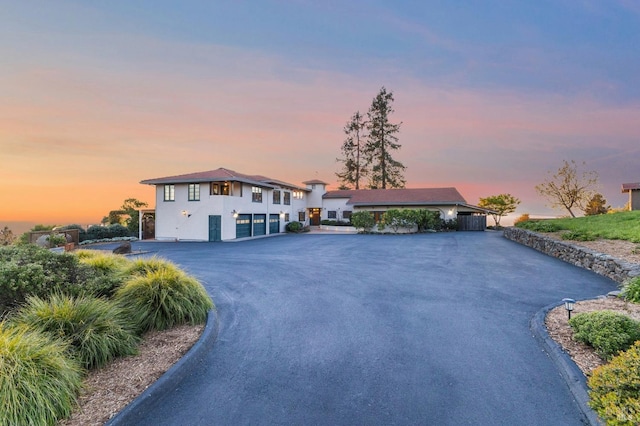 view of front of property featuring driveway and stucco siding