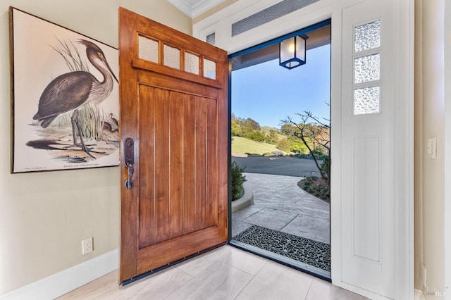 entryway featuring baseboards