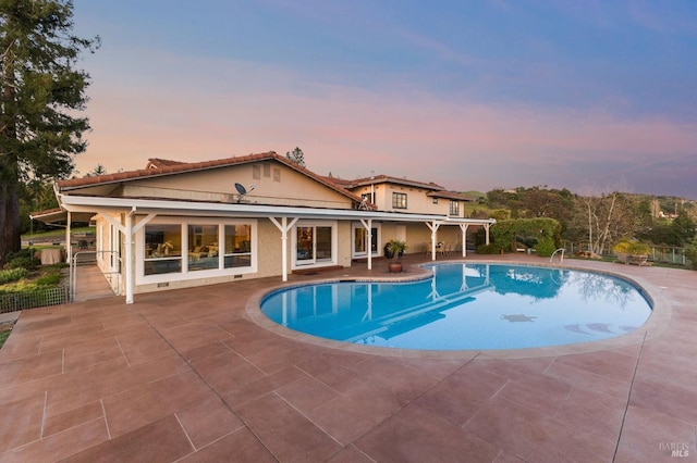outdoor pool with a patio