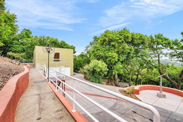 exterior space featuring a garage, driveway, and fence