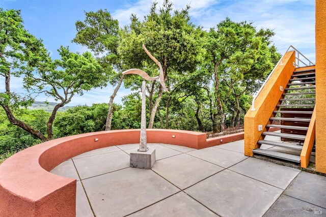 view of patio featuring stairs