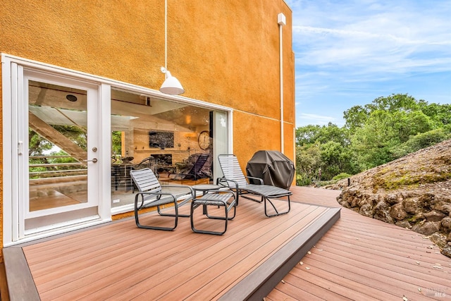wooden terrace with grilling area