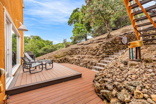 wooden deck featuring stairs