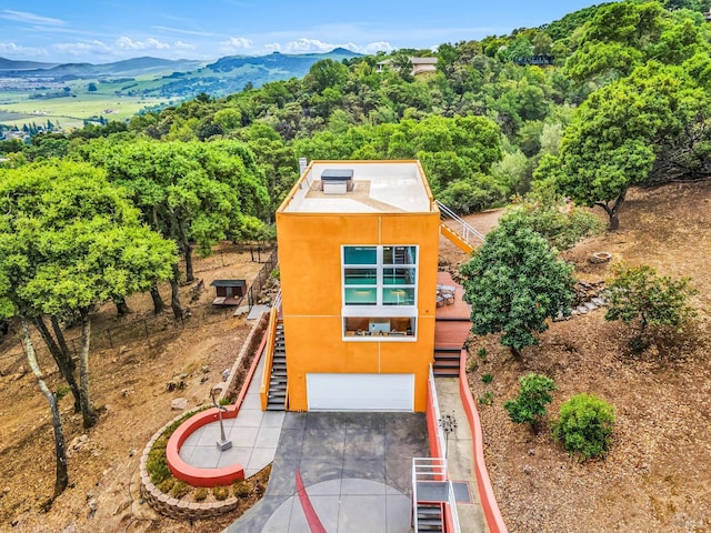 birds eye view of property with a mountain view
