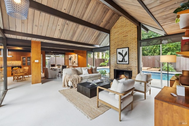 living area featuring high vaulted ceiling, a brick fireplace, beam ceiling, finished concrete floors, and wooden ceiling