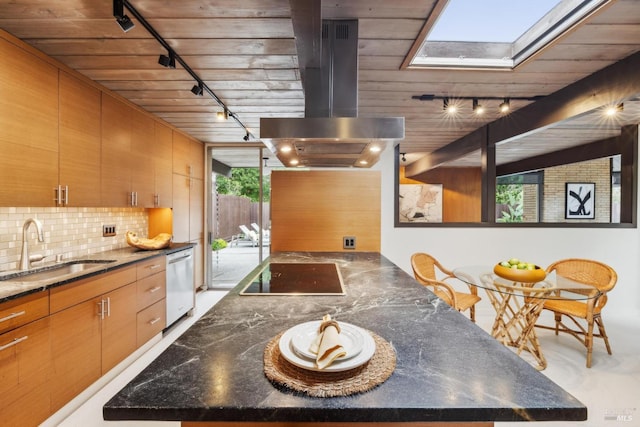 kitchen with black electric cooktop, range hood, stainless steel dishwasher, a sink, and a skylight