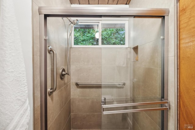 bathroom with a shower stall