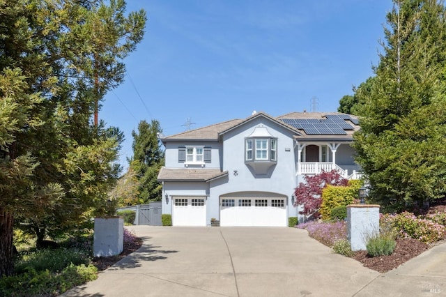 5232 Sunridge Dr, Fairfield, CA 94534 - traditional-style house featuring roof mounted solar panels, stucco siding, fence, an attached garage, and concrete driveway