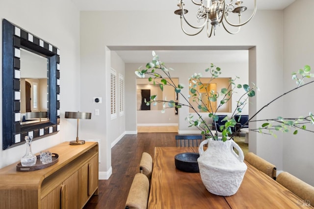 5232 Sunridge Dr, Fairfield, CA 94534 - dining area featuring dark wood-type flooring, baseboards, and an inviting chandelier