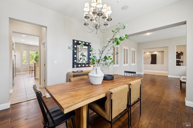 5232 Sunridge Dr, Fairfield, CA 94534 - dining area featuring recessed lighting, dark wood-type flooring, baseboards, and an inviting chandelier