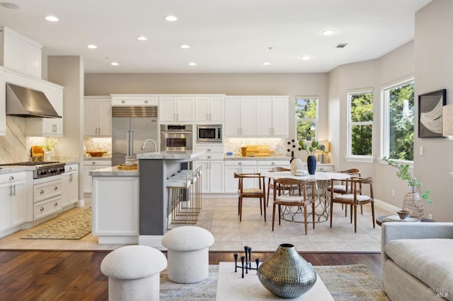 5232 Sunridge Dr, Fairfield, CA 94534 - living room with light wood-type flooring, visible vents, and recessed lighting