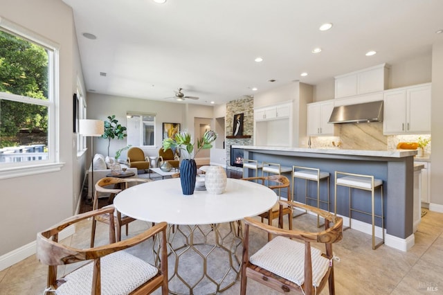 5232 Sunridge Dr, Fairfield, CA 94534 - dining space with recessed lighting, a large fireplace, baseboards, and ceiling fan