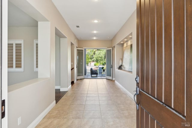 5232 Sunridge Dr, Fairfield, CA 94534 - hallway featuring light tile patterned floors, visible vents, and baseboards