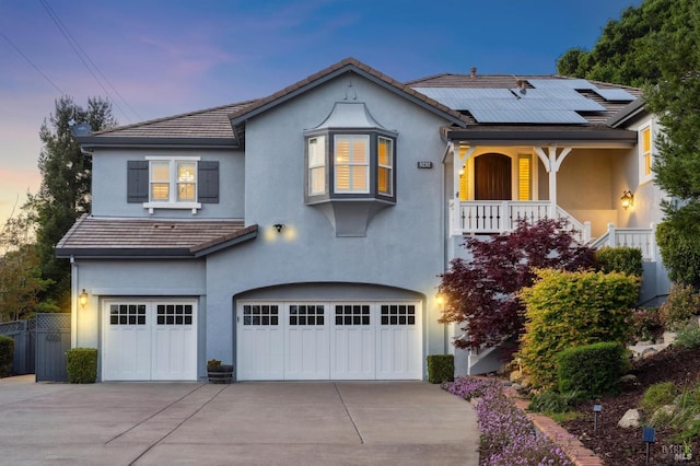 5232 Sunridge Dr, Fairfield, CA 94534 - view of front of home with concrete driveway, an attached garage, solar panels, and stucco siding