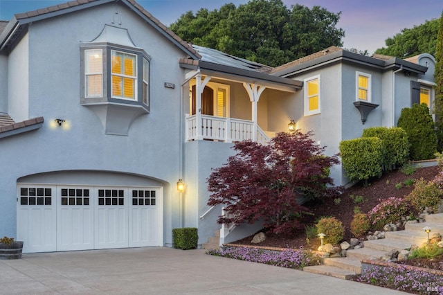 5232 Sunridge Dr, Fairfield, CA 94534 - mediterranean / spanish home featuring a tiled roof, concrete driveway, a garage, and stucco siding
