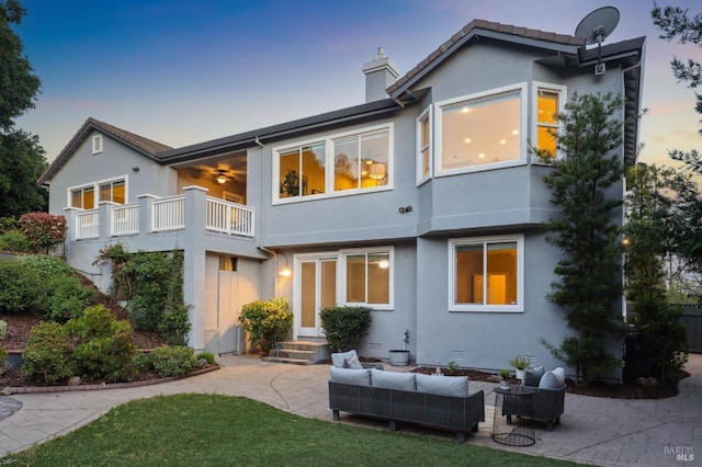 5232 Sunridge Dr, Fairfield, CA 94534 - back of property featuring outdoor lounge area, a patio area, stucco siding, and a balcony