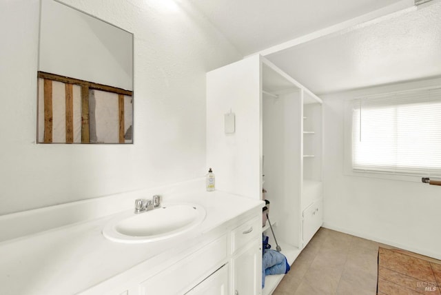 bathroom with tile patterned flooring and vanity