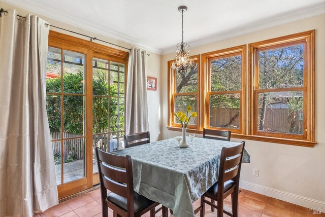 11900 Hwy 116, Guerneville, CA 95446 - dining space featuring an inviting chandelier, crown molding, and light tile patterned floors
