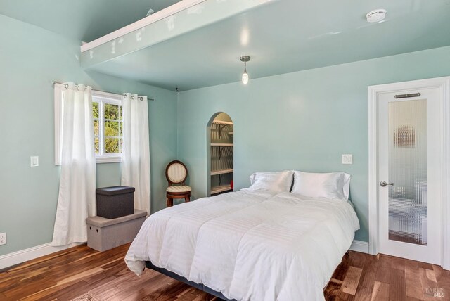 11900 Hwy 116, Guerneville, CA 95446 - bedroom with baseboards, arched walkways, and wood finished floors